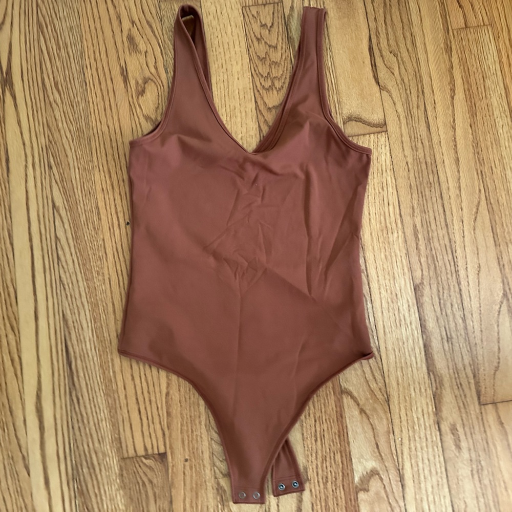 Burnt orange, double lined bodysuit